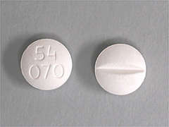This is a white round Tablet imprinted with 54  070 on the front, nothing on the back, and is manufactured by WEST-WARD/HIKMA.