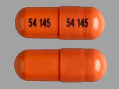 This is a red oblong Capsule imprinted with 54 145 on the front, 54 145 on the back, and is manufactured by EXELAN PHARMACE.