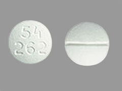 Esto es un Tableta blanco redondo imprimido con 54  262 en la parte delantera, nada en la parte posterior, y es fabricado por ROXANE/WEST-WAR.