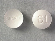 Diphenoxylate W/Atropine: This is a Tablet imprinted with SEARLE on the front, 61 on the back.