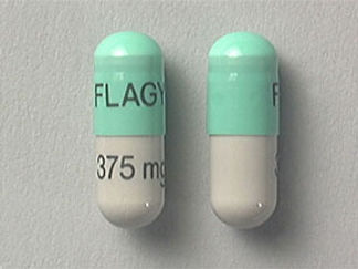 Esto es un Cápsula imprimido con FLAGYL en la parte delantera, 375 mg en la parte posterior, y es fabricado por None.