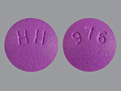 This is a purple round Tablet imprinted with 976 on the front, HH on the back, and is manufactured by SOLCO HEALTHCAR.