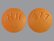 Ropinirole Hcl: This is a Tablet imprinted with 977 on the front, HH on the back.