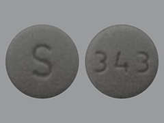 Esto es un Tableta gris redondo imprimido con S en la parte delantera, 343 en la parte posterior, y es fabricado por SOLCO HEALTHCAR.