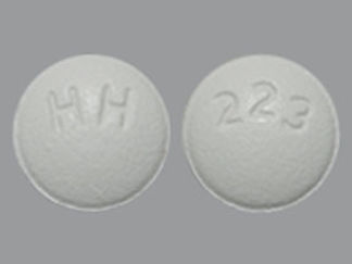 This is a Tablet imprinted with HH on the front, 223 on the back.