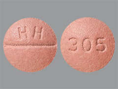 Esto es un Tableta rosado redondo imprimido con HH en la parte delantera, 305 en la parte posterior, y es fabricado por SOLCO HEALTHCAR.