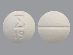 Esto es un Tableta imprimido con logo and 19 en la parte delantera, nada en la parte posterior.