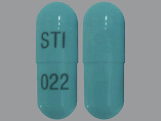 This is a Capsule imprinted with STI on the front, 022 on the back.