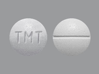 Esto es un Tableta imprimido con TMT en la parte delantera, nada en la parte posterior, y es fabricado por None.