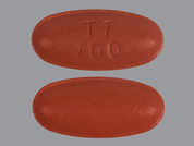 Carbidopa-Levodopa-Entacapone: This is a Tablet imprinted with T1 100 on the front, nothing on the back.