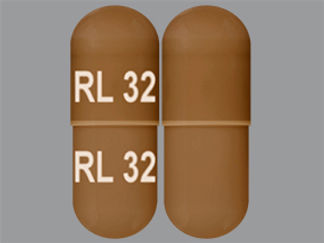 This is a Capsule imprinted with RL 32 on the front, RL 32 on the back.