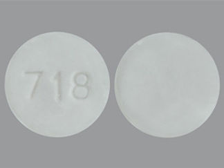 This is a Tablet imprinted with 718 on the front, nothing on the back.