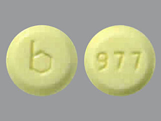 This is a Tablet imprinted with b on the front, 977 on the back.