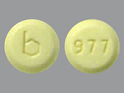 Loestrin: Esto es un Tableta imprimido con b en la parte delantera, 977 en la parte posterior, y es fabricado por None.