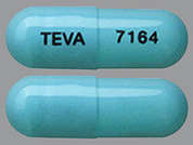 Tolterodine Tartrate Er: This is a aqua blue oblong Capsule Er 24 Hr imprinted with TEVA on the front, 7164 on the back, and is manufactured by TEVA USA.