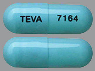 This is a Capsule Er 24 Hr imprinted with TEVA on the front, 7164 on the back.