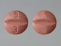 This is a reddish-brown round Tablet imprinted with 9  3 on the front, nothing on the back, and is manufactured by TORRENT PHARMAC.