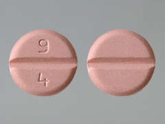 This is a light pink round Tablet imprinted with 9  4 on the front, nothing on the back, and is manufactured by TORRENT PHARMAC.