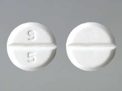 This is a Tablet imprinted with 9  5 on the front, nothing on the back.