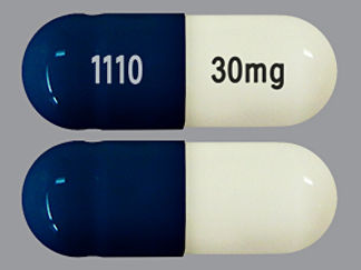 This is a Capsule Dr imprinted with 30mg on the front, 1110 on the back.