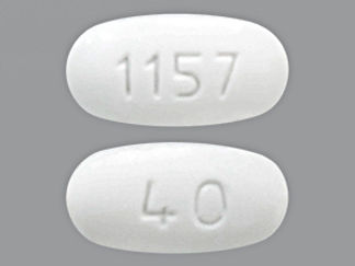 Esto es un Tableta imprimido con 1157 en la parte delantera, 40 en la parte posterior, y es fabricado por None.