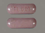 Elite-Ob: Esto es un Tableta rosado oblongo imprimido con TL 001 en la parte delantera, nada en la parte posterior, y es fabricado por TRIGEN LABORATO.
