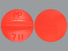 This is a red round Tablet imprinted with MP  711 on the front, nothing on the back, and is manufactured by TRUPHARMA, LLC..