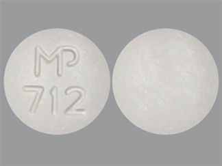 This is a Tablet imprinted with MP  712 on the front, nothing on the back.