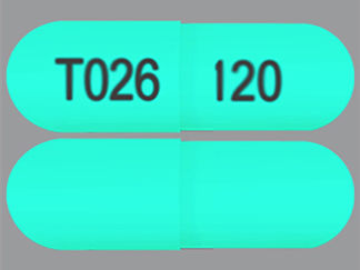 Esto es un Cápsula Er 24 Hr imprimido con T026 en la parte delantera, 120 en la parte posterior, y es fabricado por None.