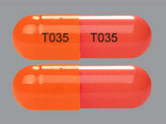 This is a red oblong Capsule Er 24 Hr imprinted with T035 on the front, T035 on the back, and is manufactured by TWI/UPSHER.