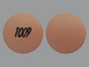 Nifedipine Er: This is a Tablet Er 24 Hr imprinted with T009 on the front, nothing on the back.