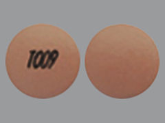 This is a Tablet Er 24 Hr imprinted with T009 on the front, nothing on the back.