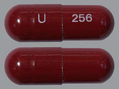 This is a maroon oblong Capsule imprinted with U on the front, 256 on the back, and is manufactured by UNICHEM PHARMAC.