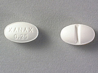 This is a Tablet imprinted with XANAX  0.25 on the front, nothing on the back.