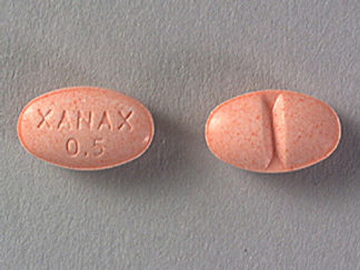 This is a Tablet imprinted with XANAX  0.5 on the front, nothing on the back.