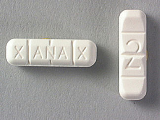 Esto es un Tableta imprimido con XANAX en la parte delantera, 2 en la parte posterior, y es fabricado por None.