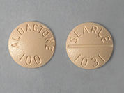 Aldactone: This is a Tablet imprinted with ALDACTONE  100 on the front, SEARLE  1031 on the back.