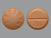 Lodosyn: Esto es un Tableta imprimido con LODOSYN en la parte delantera, 711 en la parte posterior, y es fabricado por None.