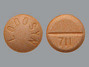 Lodosyn: This is a orange round Tablet imprinted with LODOSYN on the front, 711 on the back, and is manufactured by BAUSCH HEALTH U.