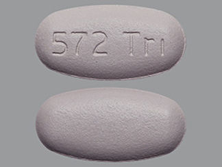 This is a Tablet imprinted with 572 Tri on the front, nothing on the back.