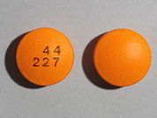 Aspirin Ec: Esto es un Tableta Dr imprimido con 44  227 en la parte delantera, nada en la parte posterior, y es fabricado por None.