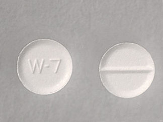 This is a Tablet imprinted with W-7 on the front, nothing on the back.