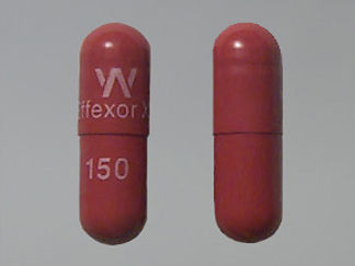 This is a Capsule Er 24 Hr imprinted with W  Effexor XR on the front, 150 on the back.