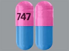 This is a Capsule Er 24hr imprinted with 747 on the front, nothing on the back.