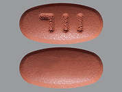 Mesalamine: Esto es un Tableta LP marrón rojizo oval imprimido con 711 en la parte delantera, nada en la parte posterior, y es fabricado por MAJOR PHARMACEU.