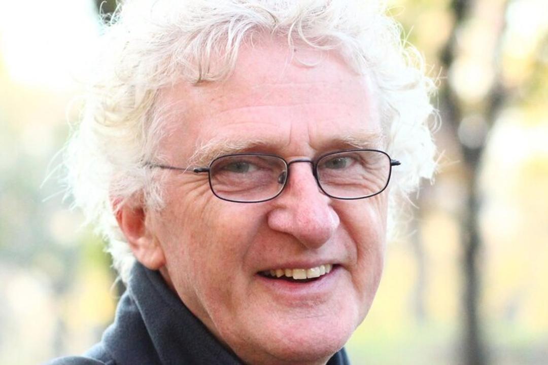 Terry Denton. Older man with white hair, glasses, smiling outdoors