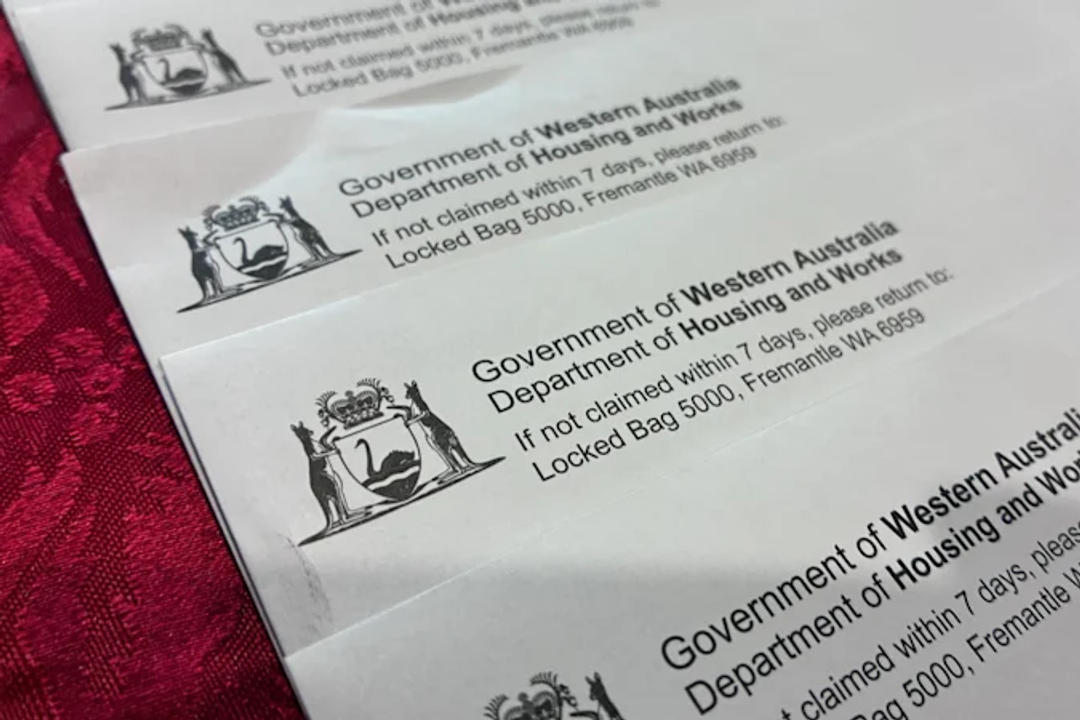 Printed government notices from WA Department of Housing and Works showing locked bag return instructions