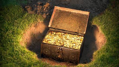 Open treasure chest overflowing with gold coins, half-buried in soil surrounded by grass