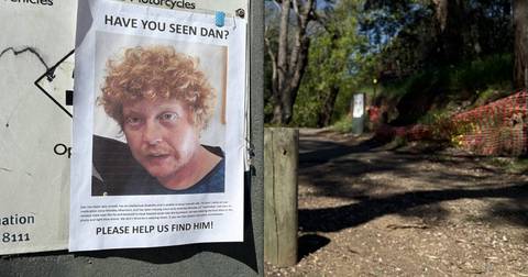 Missing person poster for Daniel Trenchard-Harry attached to utility box on residential street