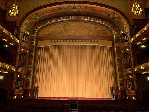 File image: Ornate Art Deco theatre interior with closed stage curtains